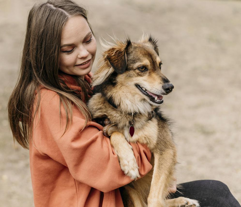 pretty young woman petting her dog
