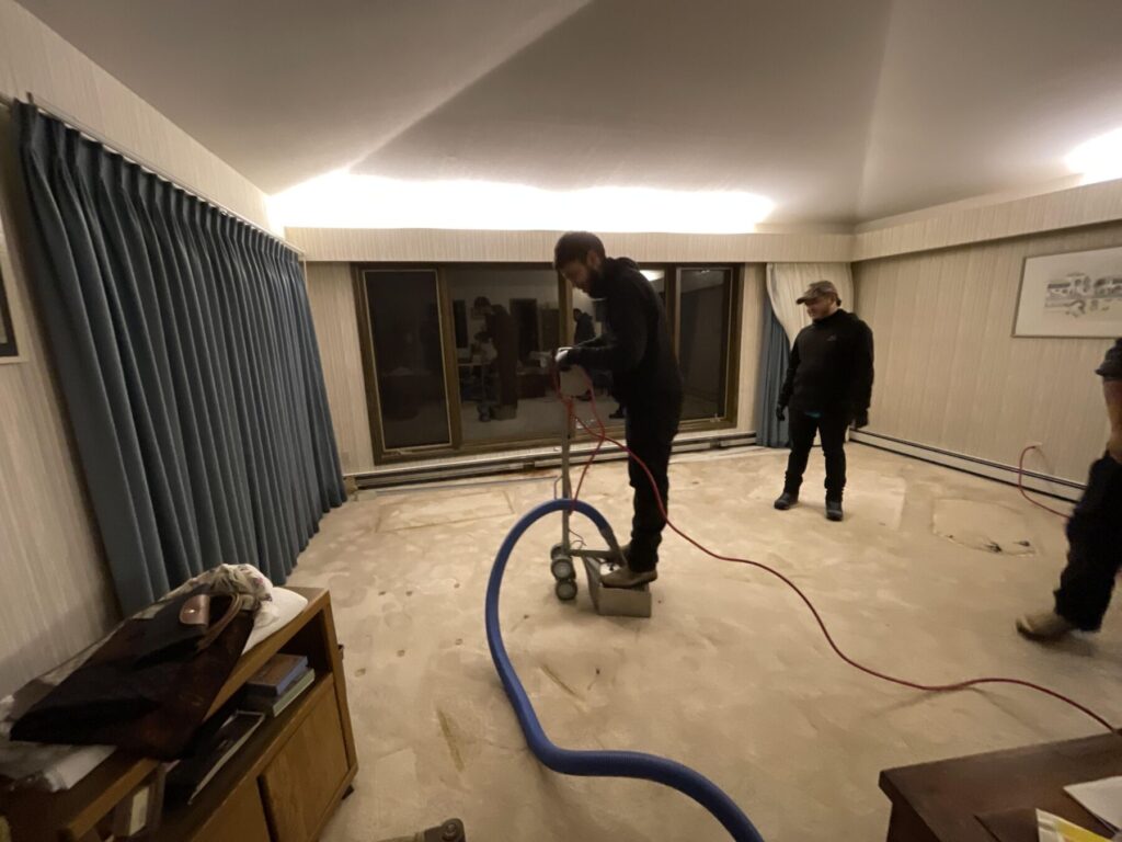 restoration specialists drying carpet