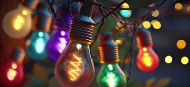 Glowing colorful party light bulbs close up
