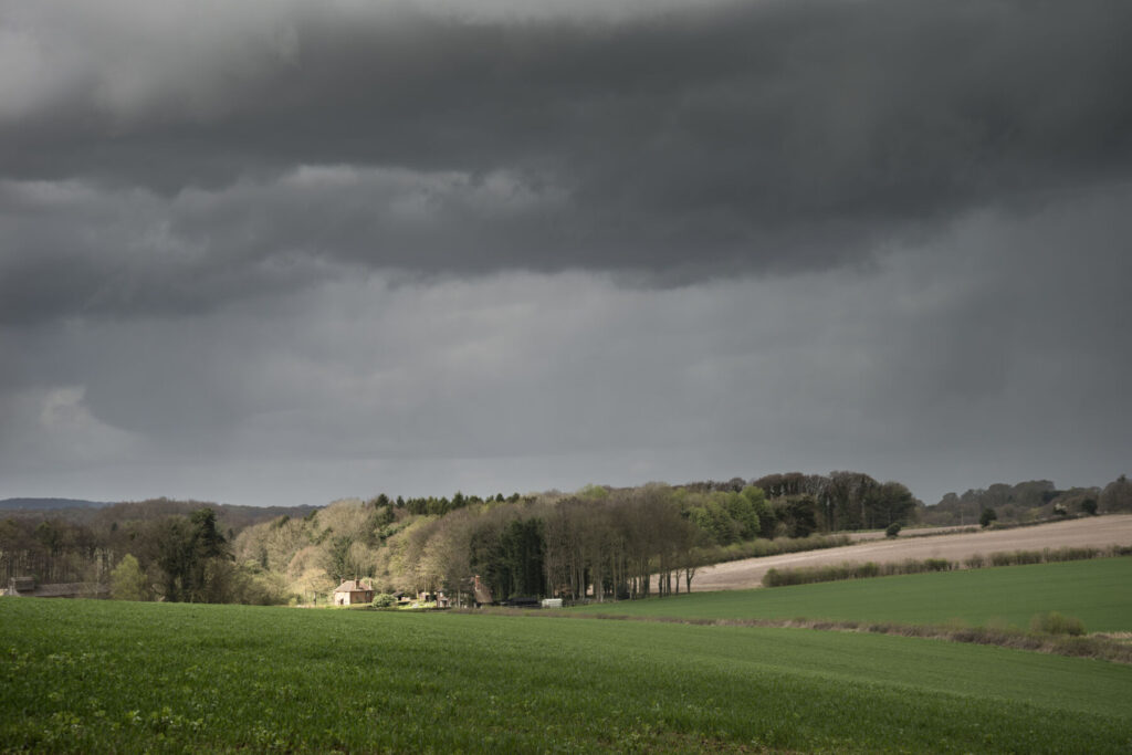 Beautiful agricultural English countryside landscape during early Spring morning