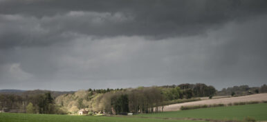 Beautiful agricultural English countryside landscape during early Spring morning
