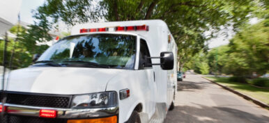 Ambulance vehicle travelling to accident, motion blur to give sense of speed